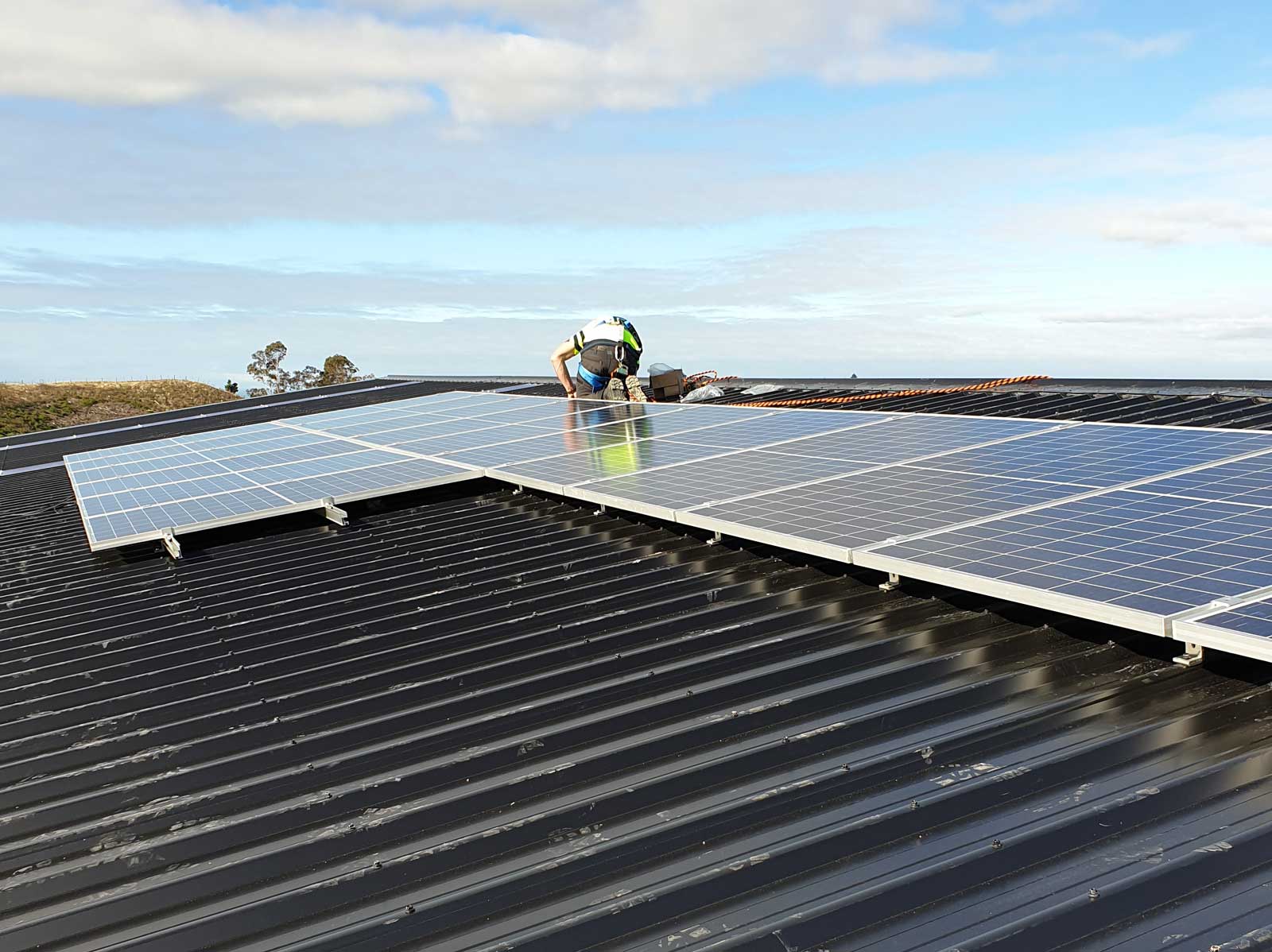 Installing solar power panels on a commercial building